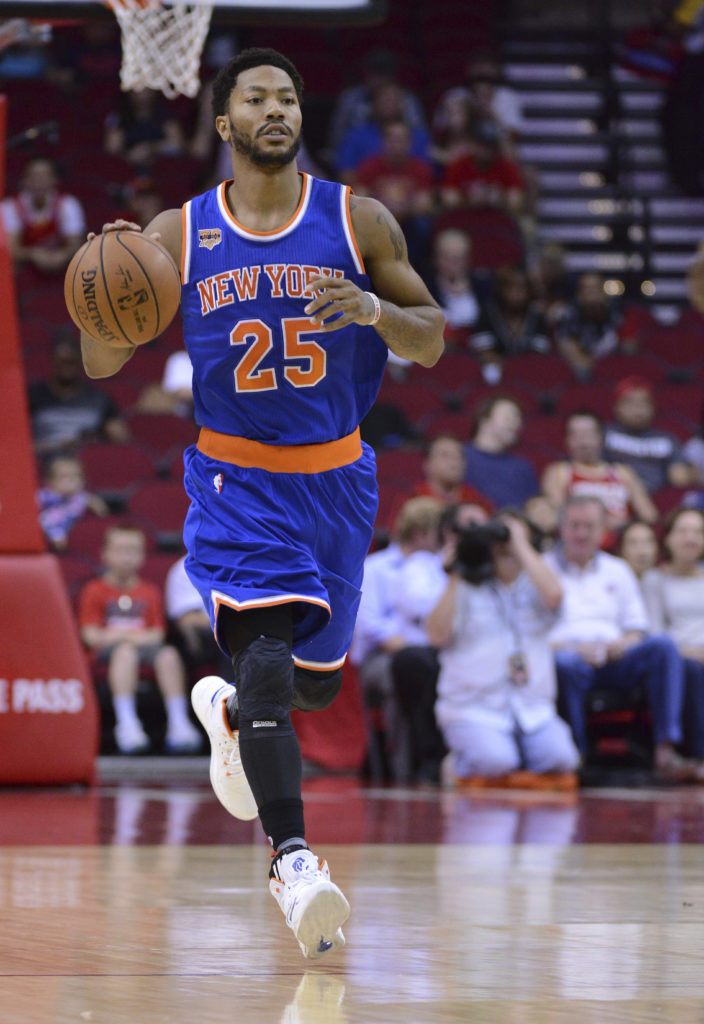 New York Knicks guard Derrick Rose takes the ball down court against the Houston Rockets in the first half of an NBA preseason game, Tuesday, Oct. 4, 2016, in Houston. (AP Photo/George Bridges)
