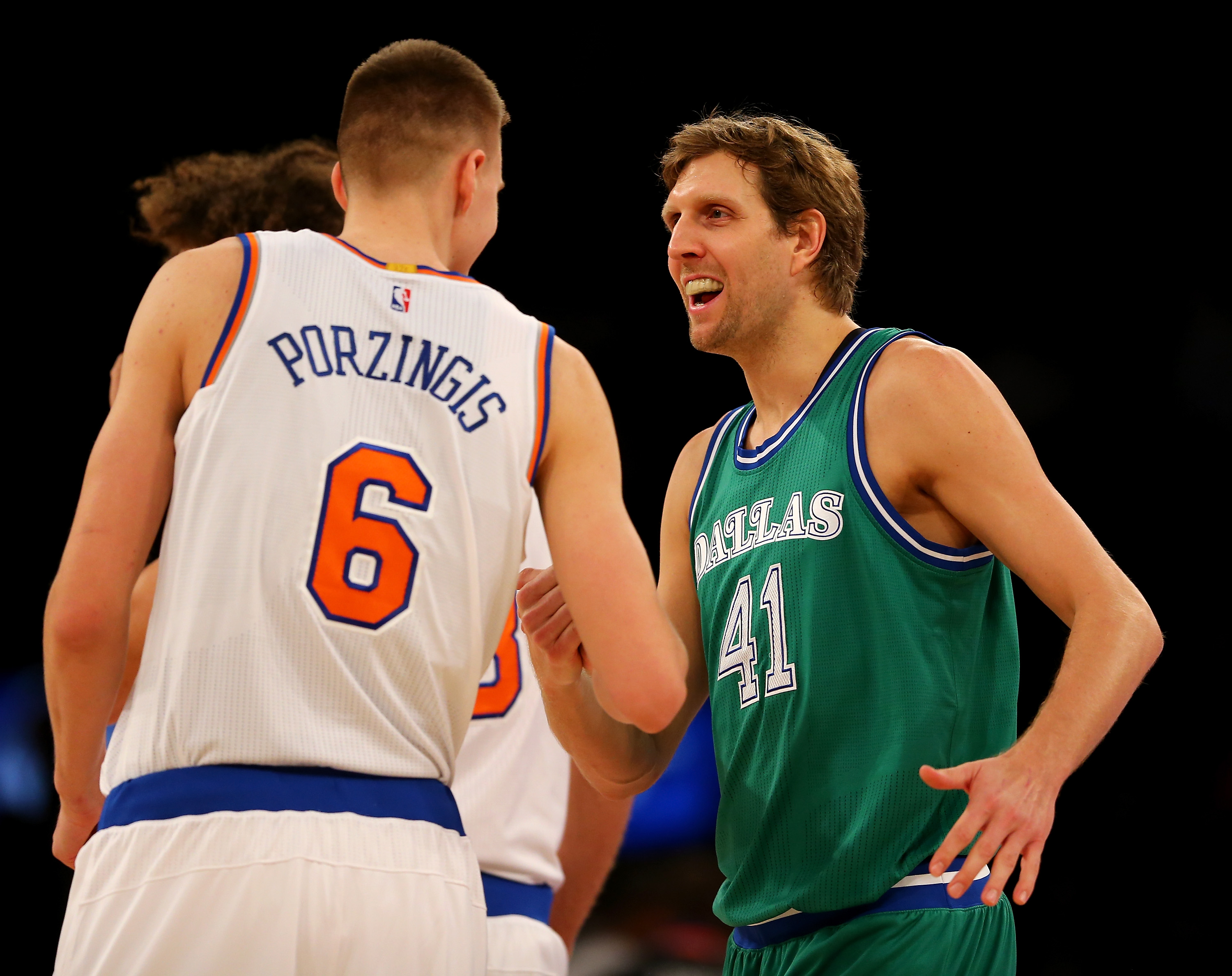 NEW YORK, NY - DECEMBER 07: Kristaps Porzingis #6 of the New York Knicks and Dirk Nowitzki #41 of the Dallas Mavericks greet each other before the opening tipoff at Madison Square Garden on December 7, 2015 in New York City. NOTE TO USER: User expressly acknowledges and agrees that, by downloading and/or using this Photograph, user is consenting to the terms and conditions of the Getty Images License Agreement. (Photo by Elsa/Getty Images)