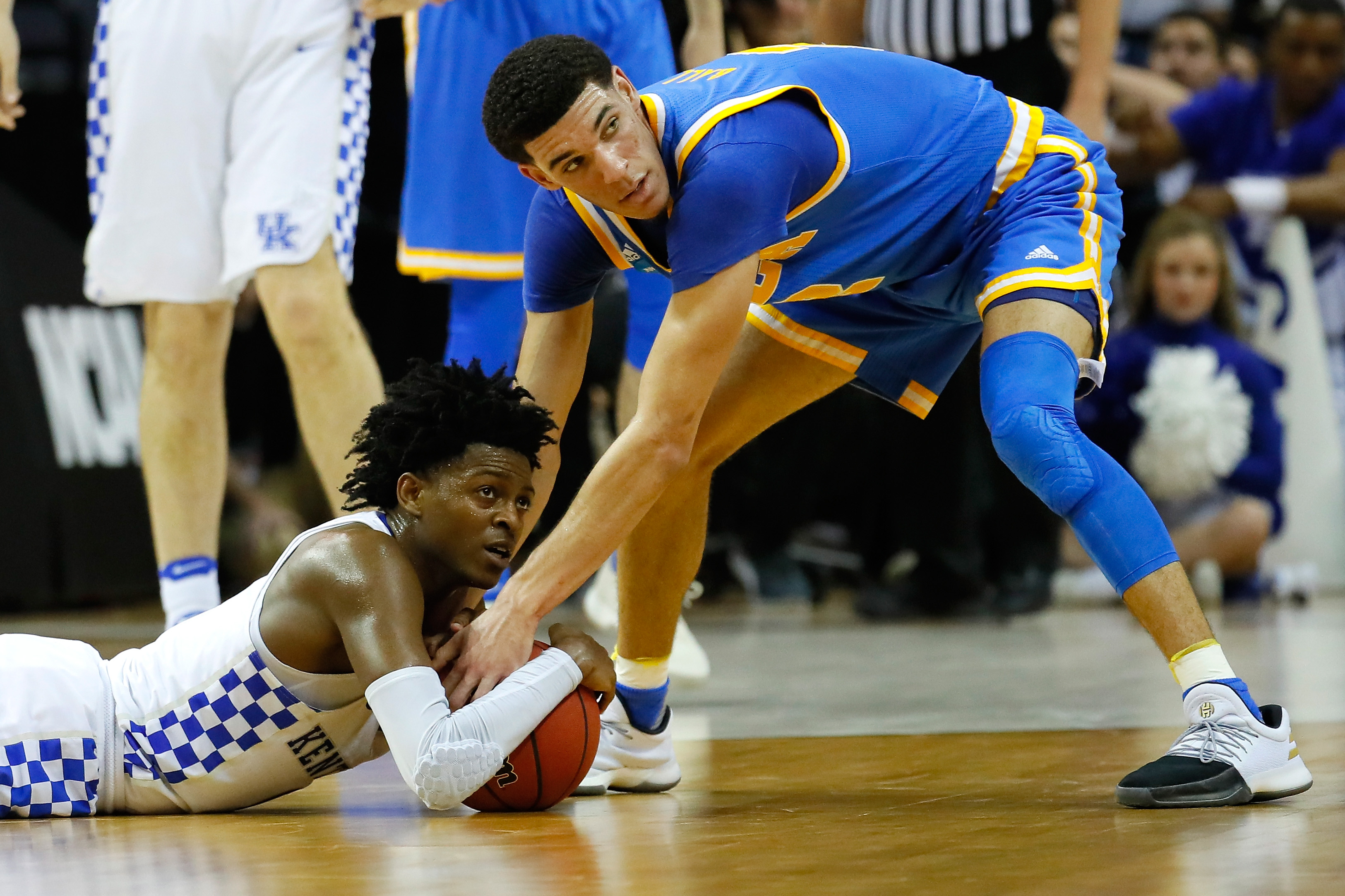 MEMPHIS, TN - MARCH 24: De'Aaron Fox #0 of the Kentucky Wildcats and Lonzo Ball #2 of the UCLA Bruins compete for a lose ball in the second half during the 2017 NCAA Men's Basketball Tournament South Regional at FedExForum on March 24, 2017 in Memphis, Tennessee. (Photo by Kevin C. Cox/Getty Images)