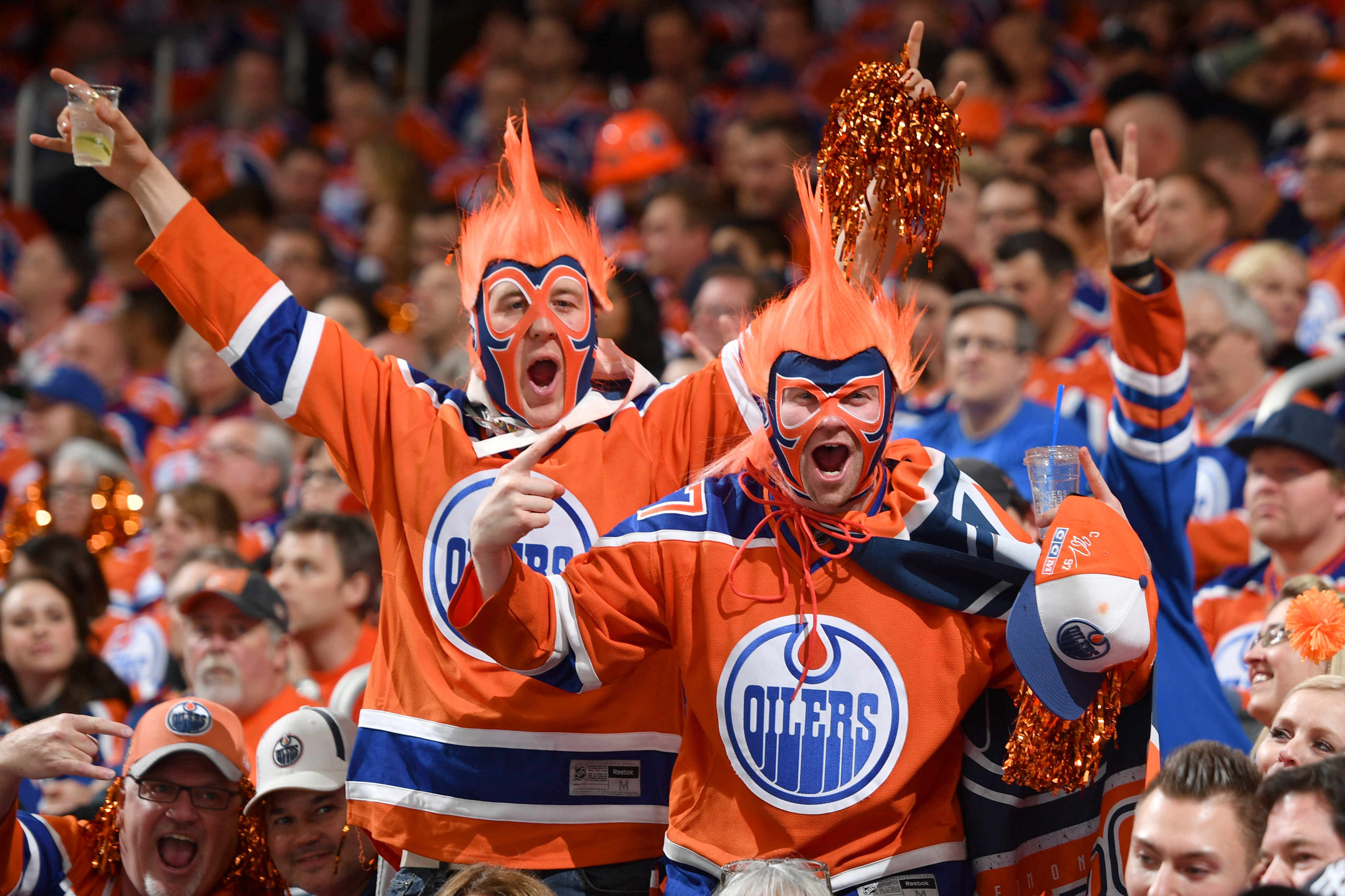 EDMONTON, AB - APRIL 12: Fans of the Edmonton Oilers celebrate after a goal during Game One of the Western Conference First Round during the 2017 NHL Stanley Cup Playoffs against the San Jose Sharks on April 12, 2017 at Rogers Place in Edmonton, Alberta, Canada. (Photo by Andy Devlin/NHLI via Getty Images)